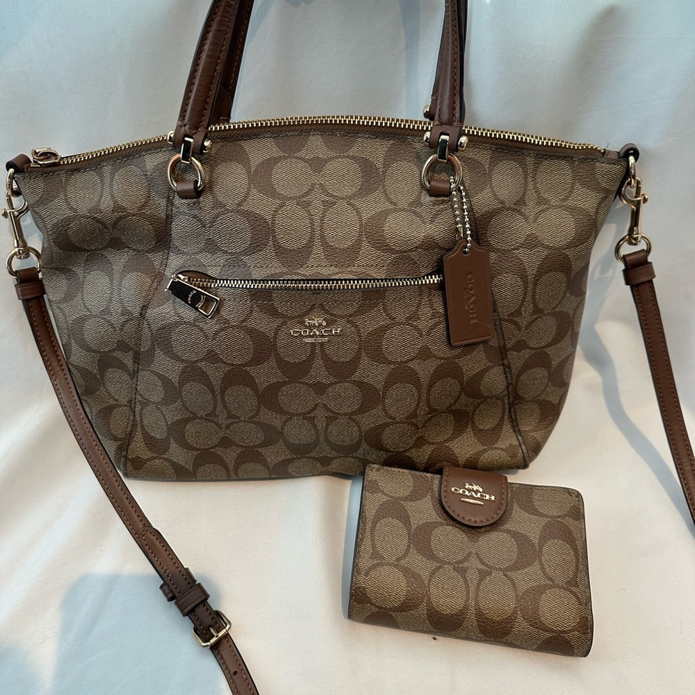 Coach Signature domed satchel and matching medium zip wallet.